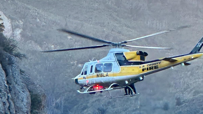 Life-Saving Lift: Heroic Heli Crew Rescues Stranded Passenger.